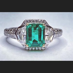 1.47 superb Natural Emerald cut Emerald and dismond ring by Fredrick Sage.